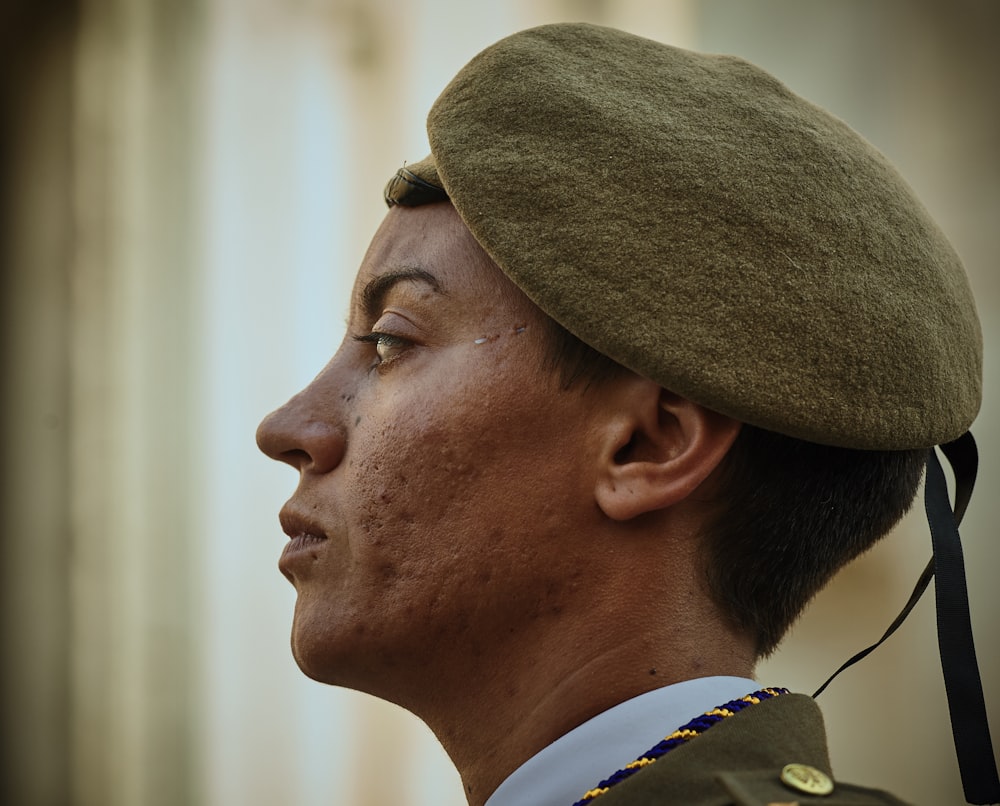 man wearing green suede beret hat