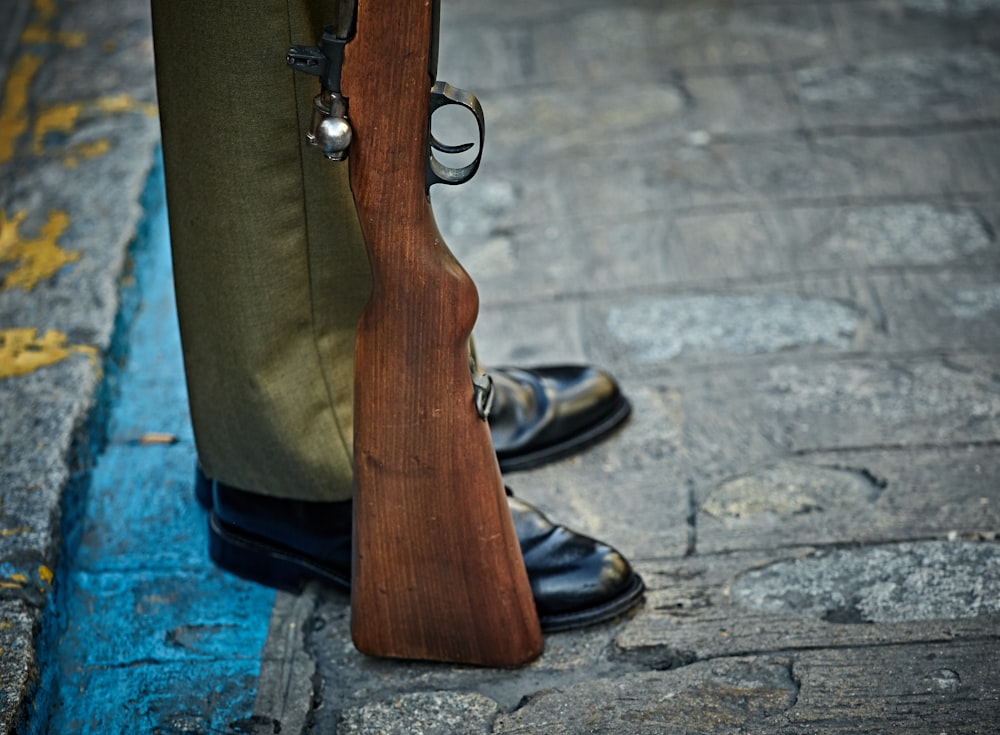 man standing with rifle