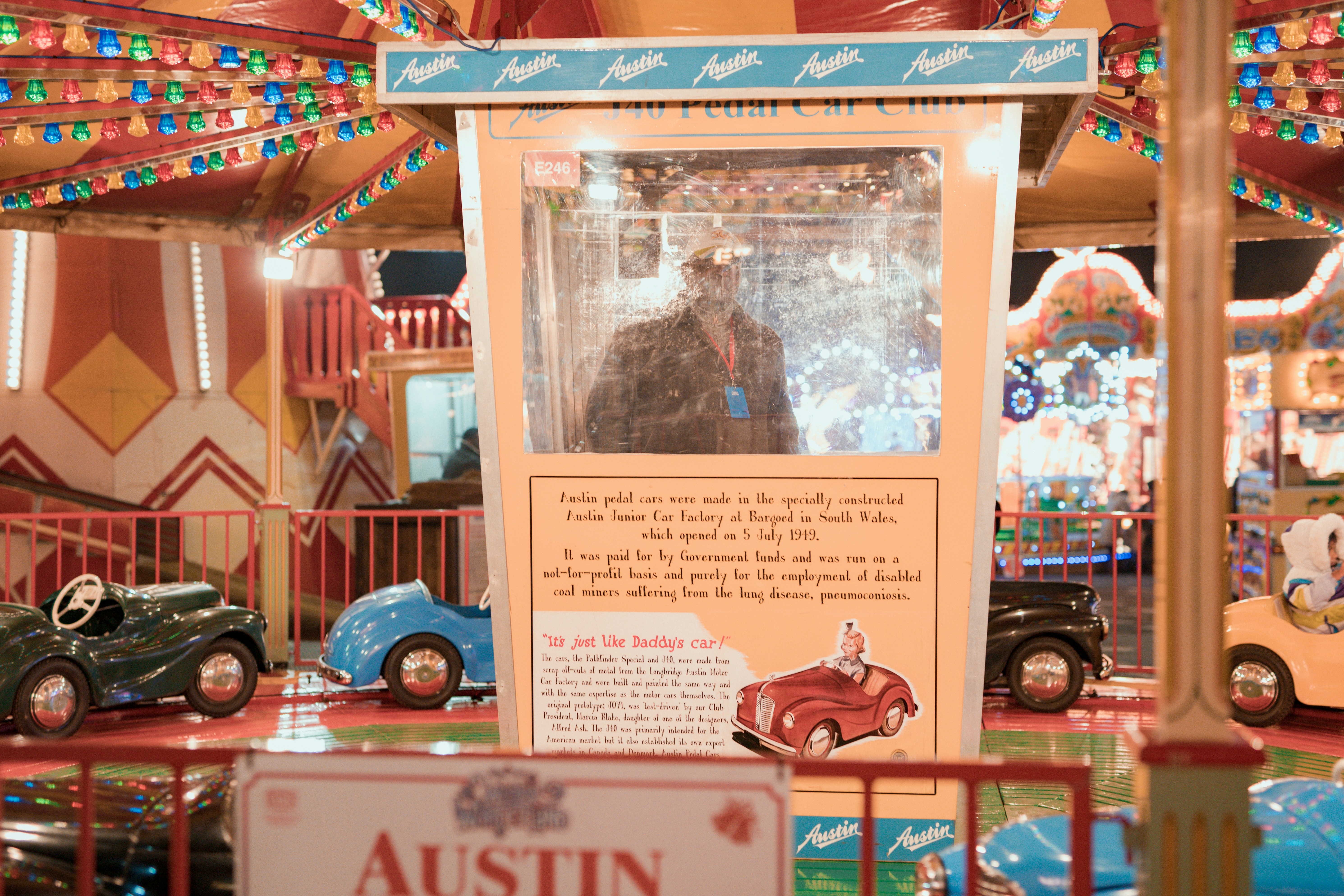 person standing inside booth