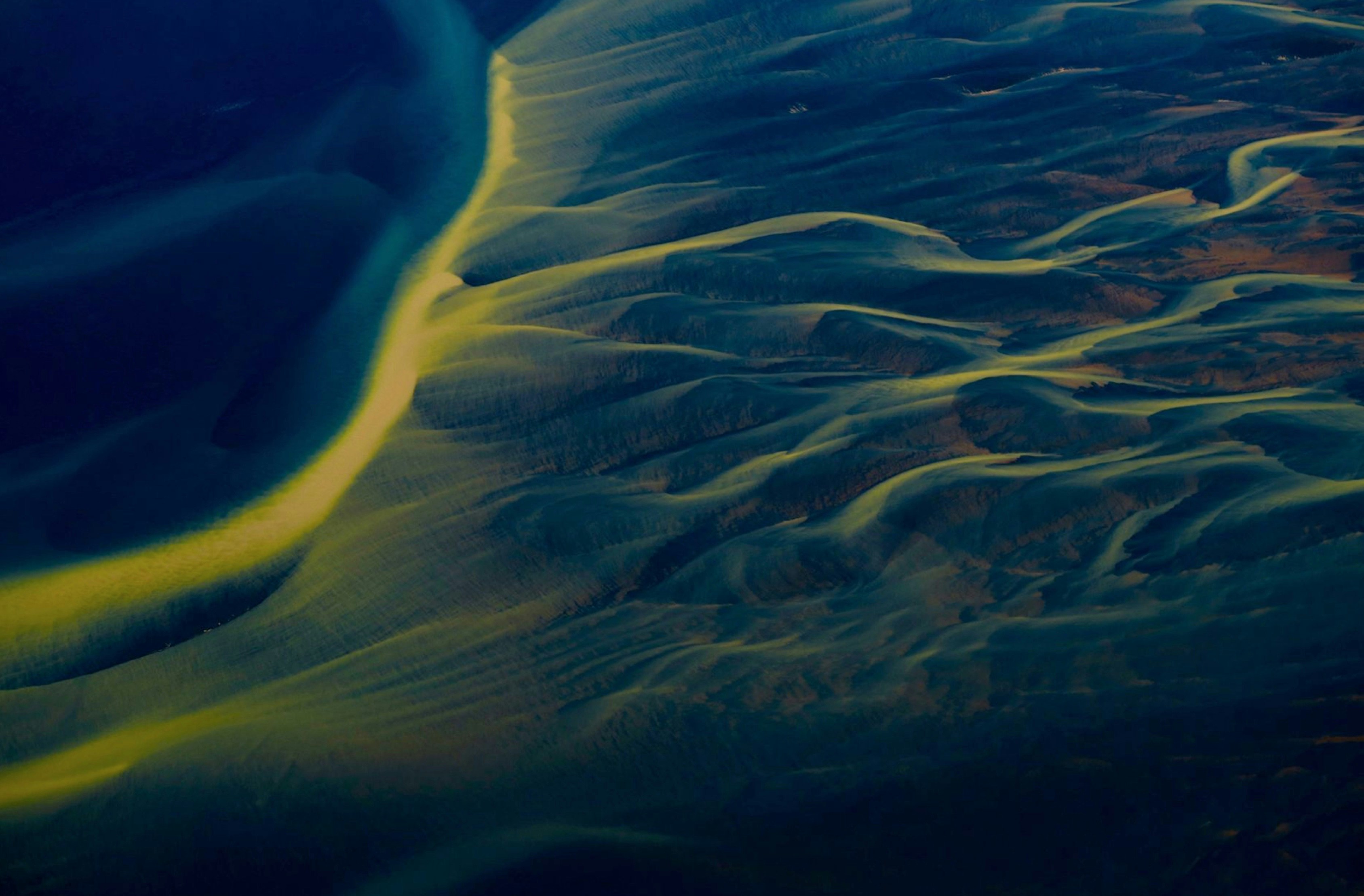 I was flying in Cessna 172 over this Delta. The sun was going down and colored the river and the ocean as well as the sandy land.by Freysteinn G. Jonsson