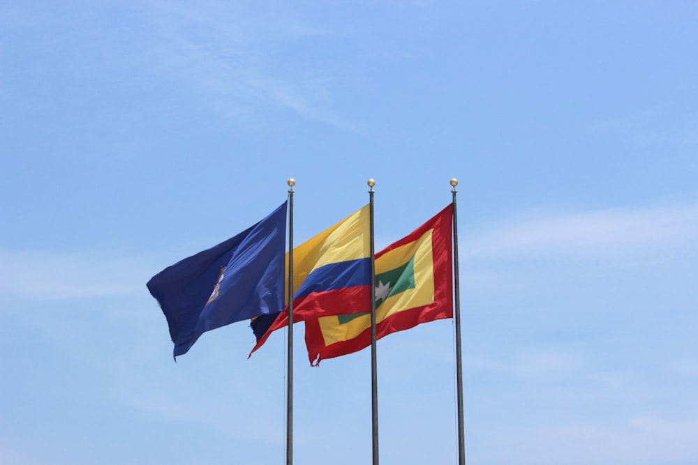 three flags in pole