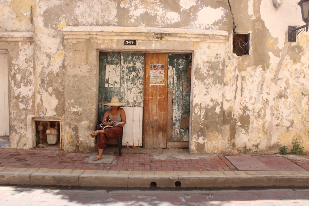 woman sitting on chair near door