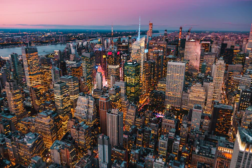 lighted high-rise buildings during golden hour