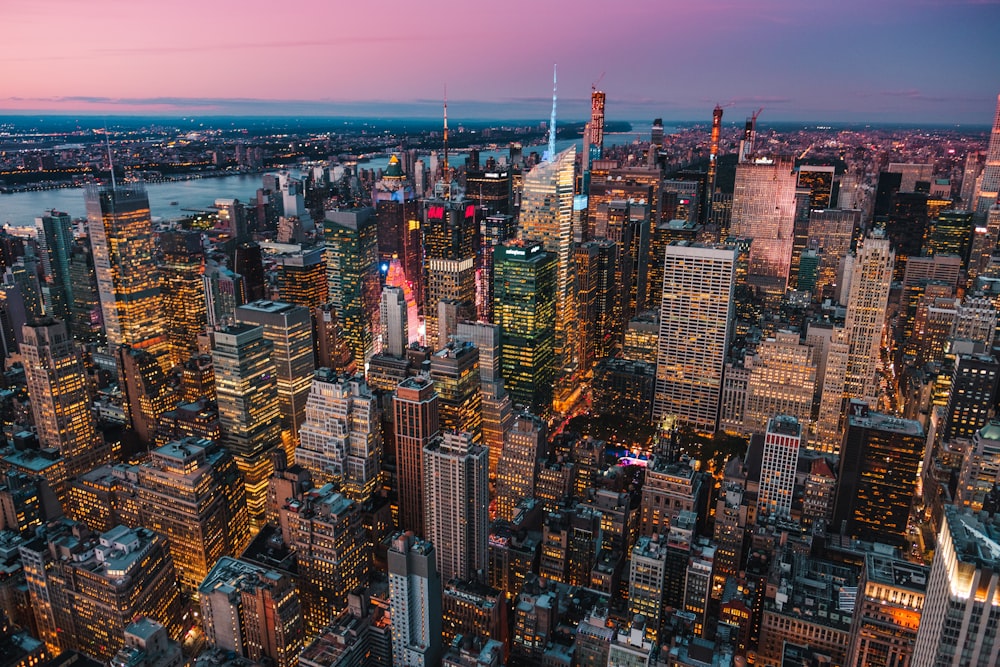 lighted high-rise buildings during golden hour