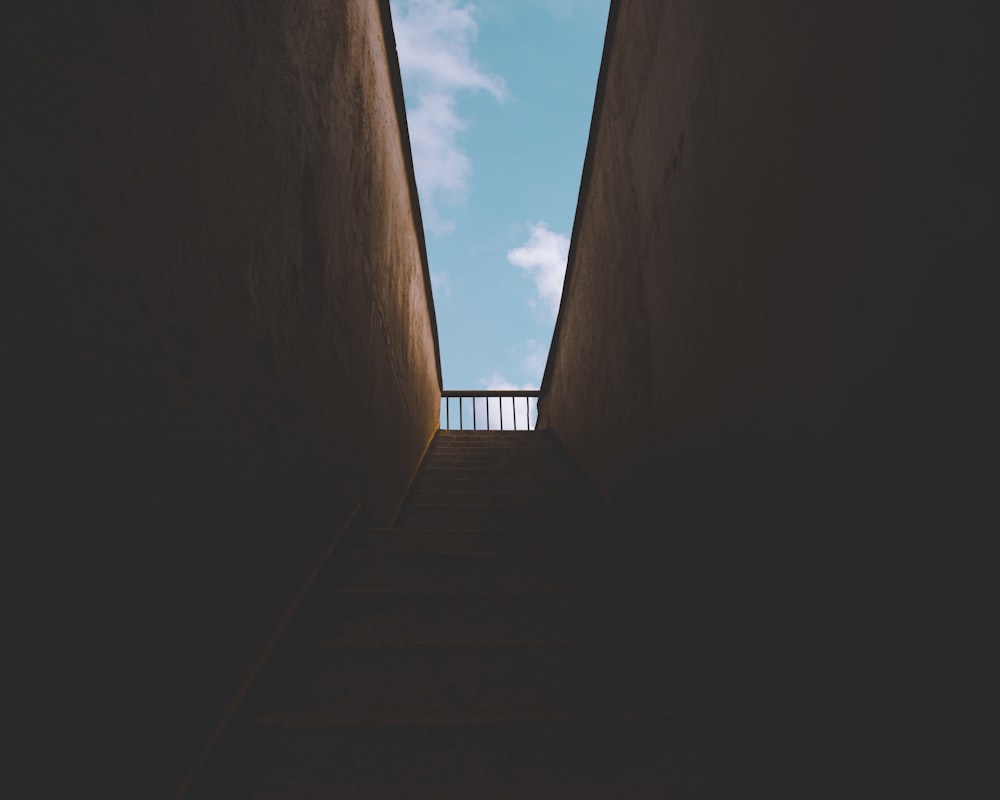 gray concrete stairs under blue sky