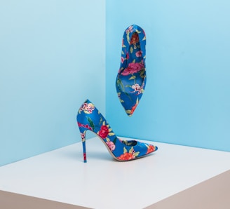 pair of blue-and-pink floral almond-toe pumps