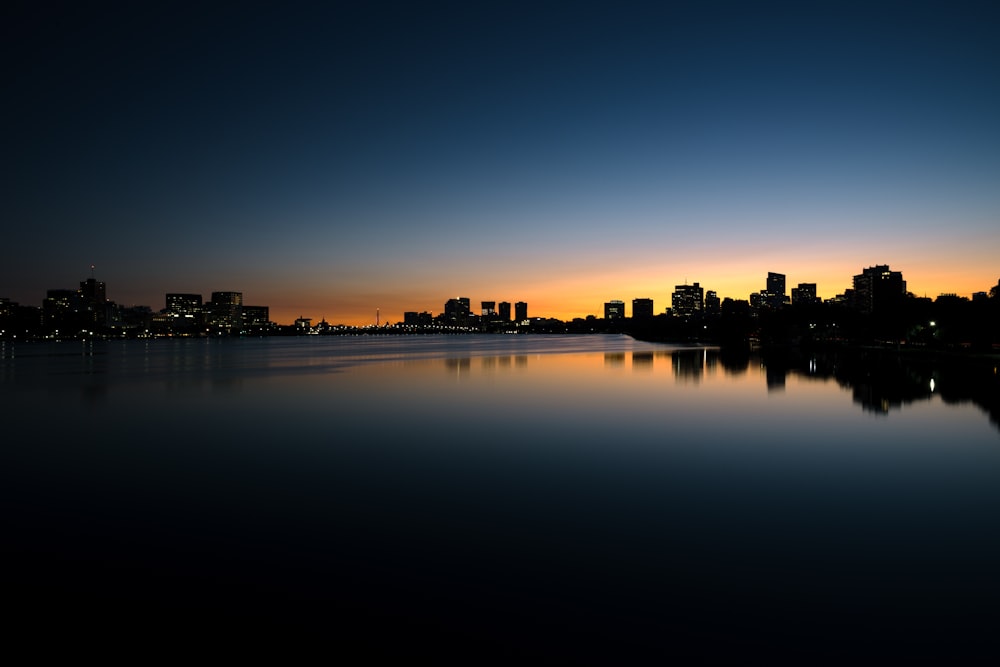 calm body of water near building