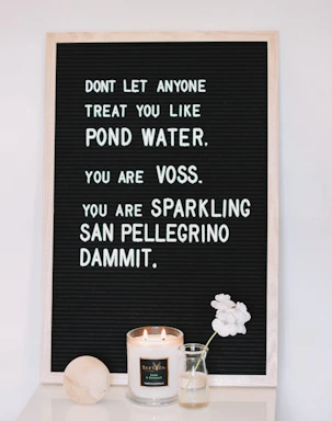 A warm, inviting workspace with a handwritten note and a glowing candle symbolizing hope and connection.