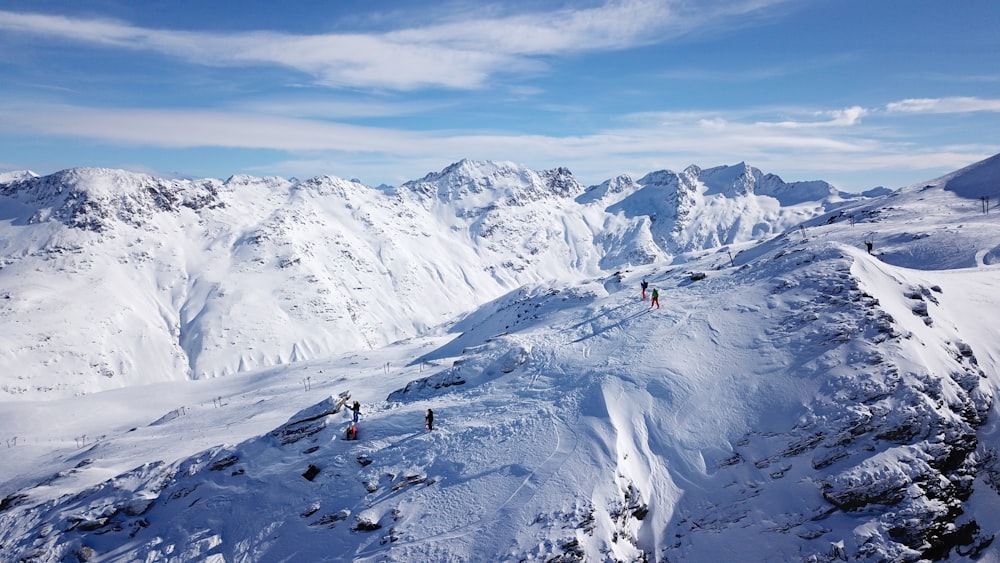 people walking on top of mountain