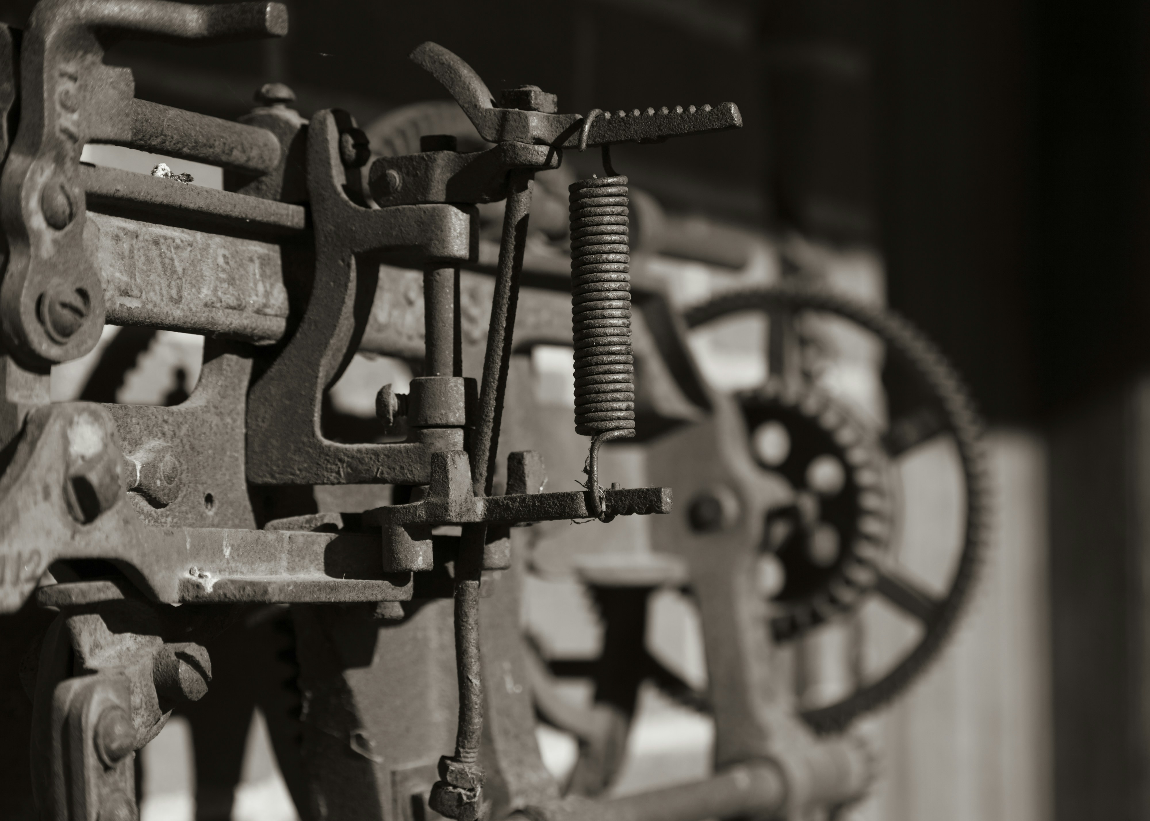 grayscale photography of industrial machine