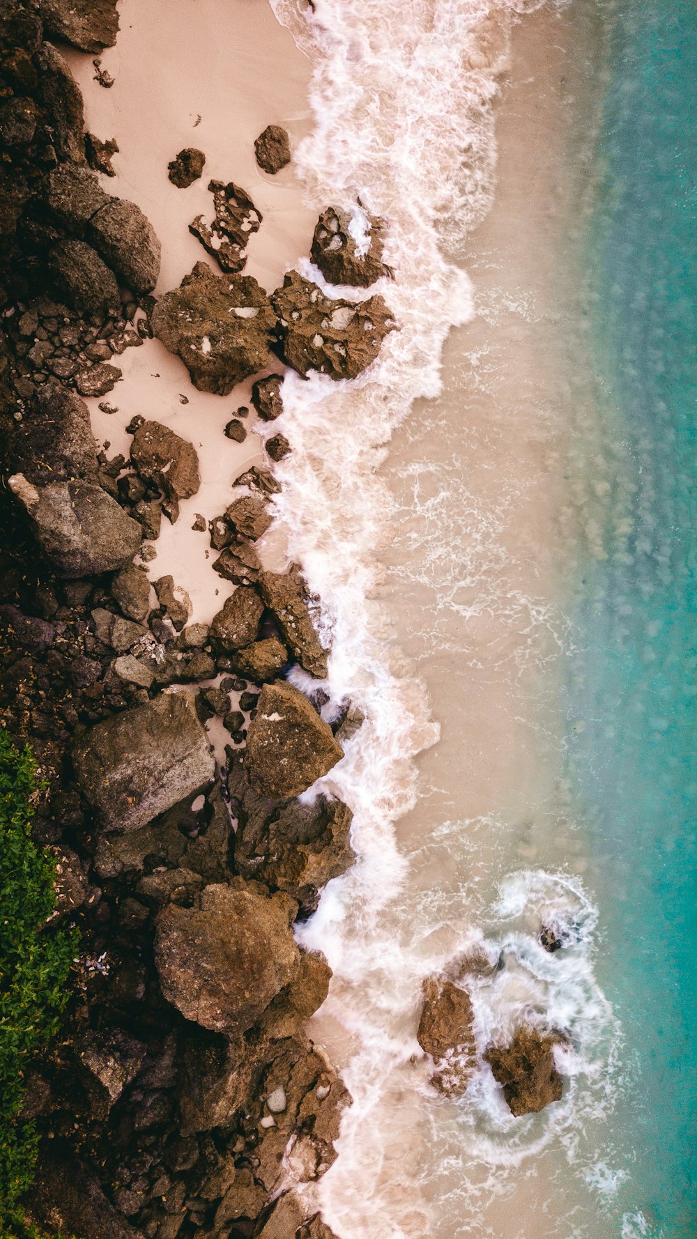 sea waves near rock formation at daytime