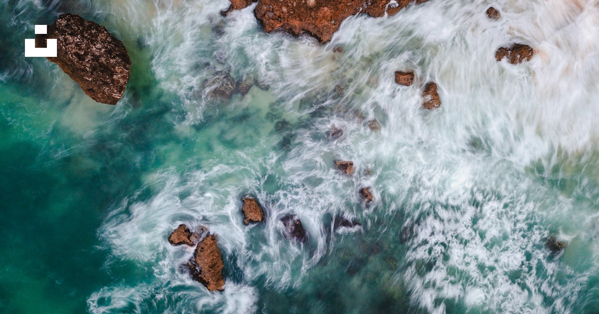 Body of water with rock formation wallpaper photo – Free Nature Image ...