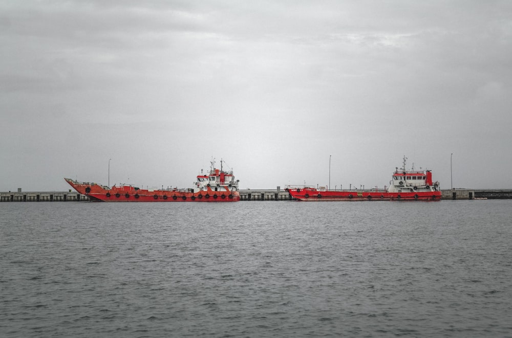 two red sailing boats