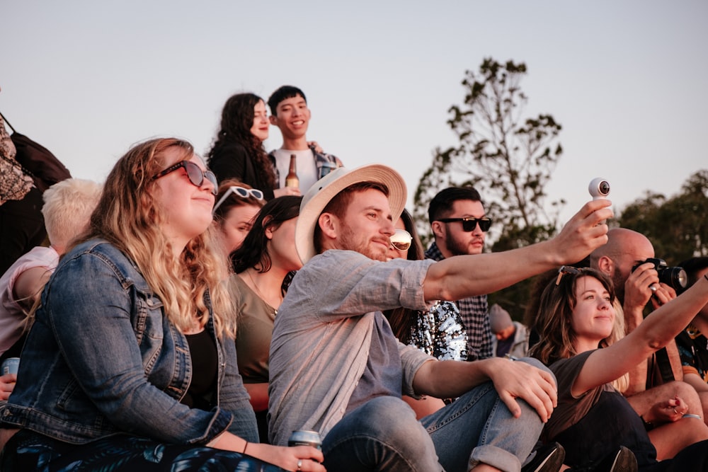 man taking selfie while sitting