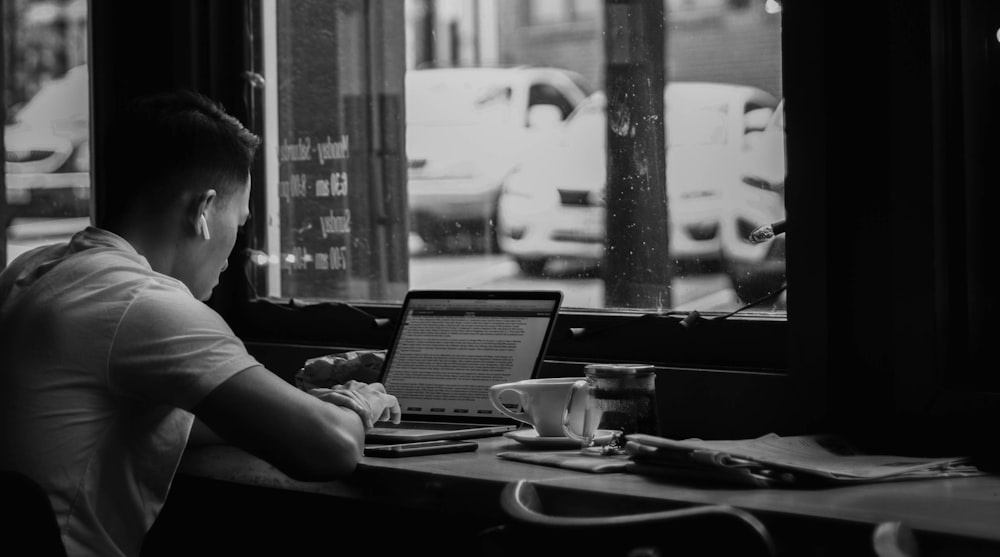 man looking at laptop