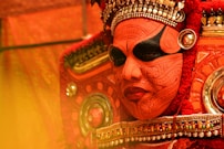 person in facial paint and costume