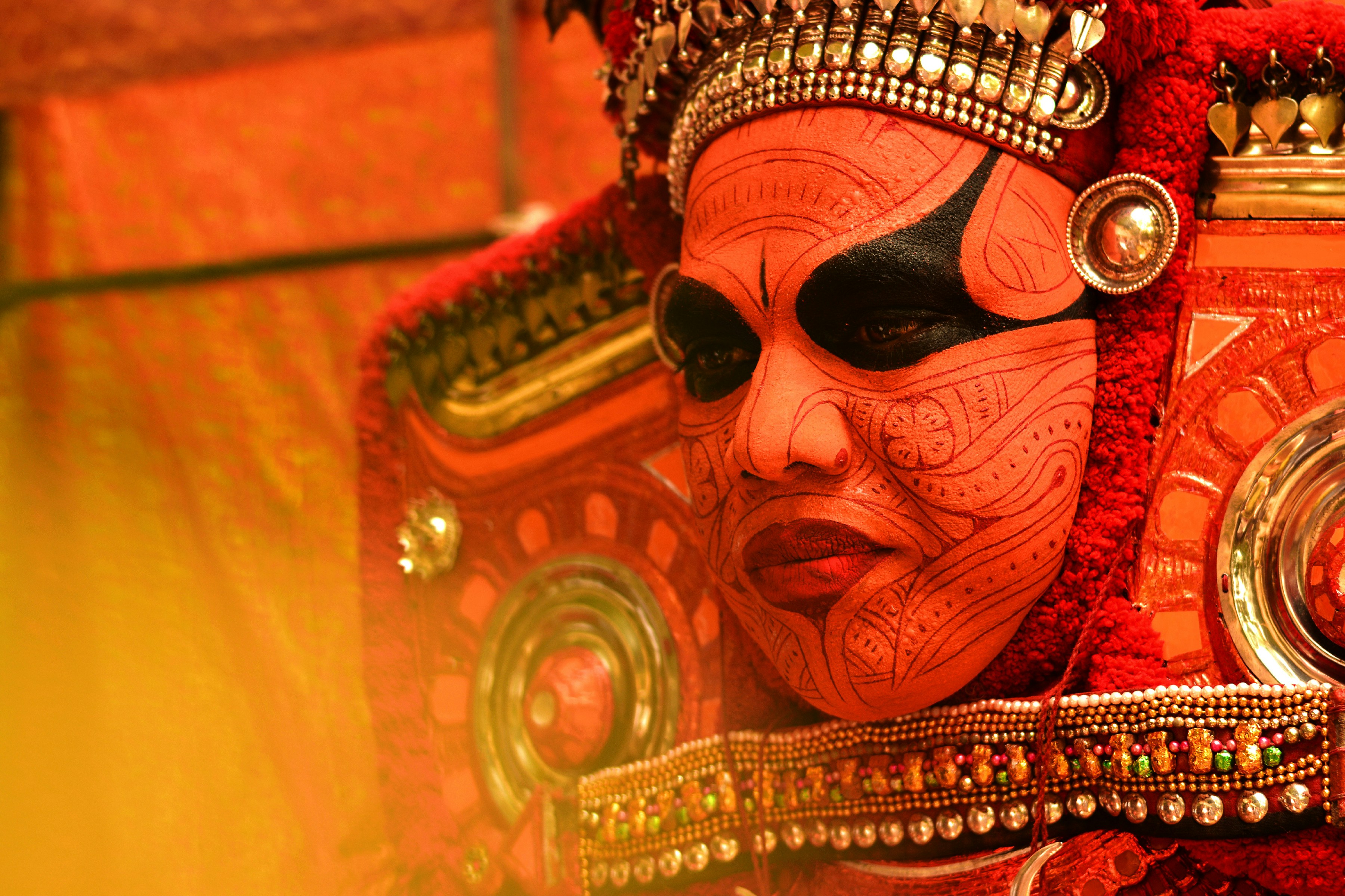 Theyyam is a popular ritual form of worship of North Malabar in Kerala, India. People consider Theyyam itself as a God and they seek blessings from them.\r
This shot is of ‘Aaralathu Bhagavati*’, from my home in Nileshwaram (Kasargod district), Kerala.\r
\r
*Bhagavati, is a word of Sanskrit origin, used in India as a polite form to address or as an honorific title for female deities in Hinduism.