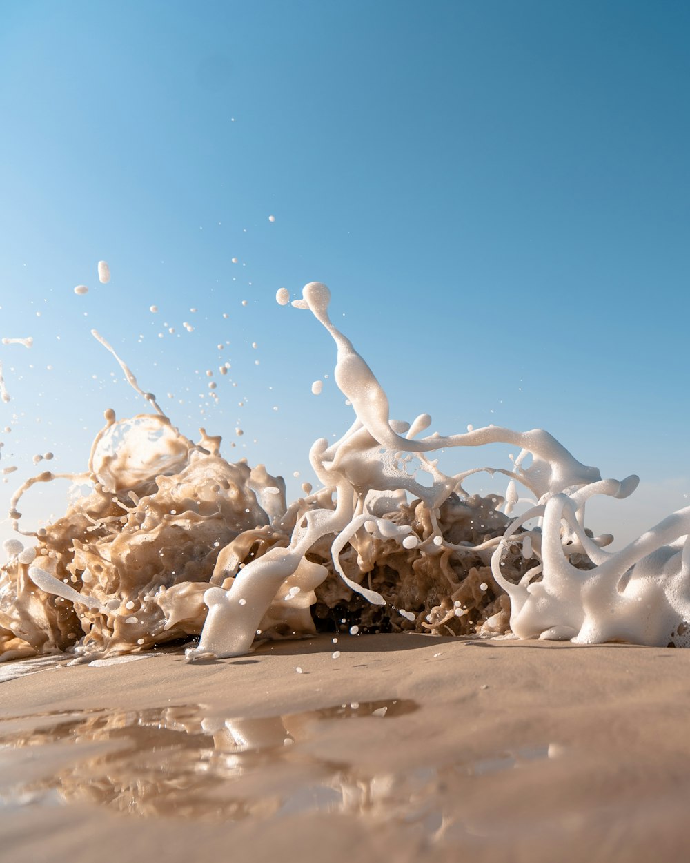 waves crashing on shore during daytime