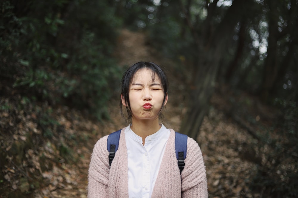 selective focus photography of woman in forest