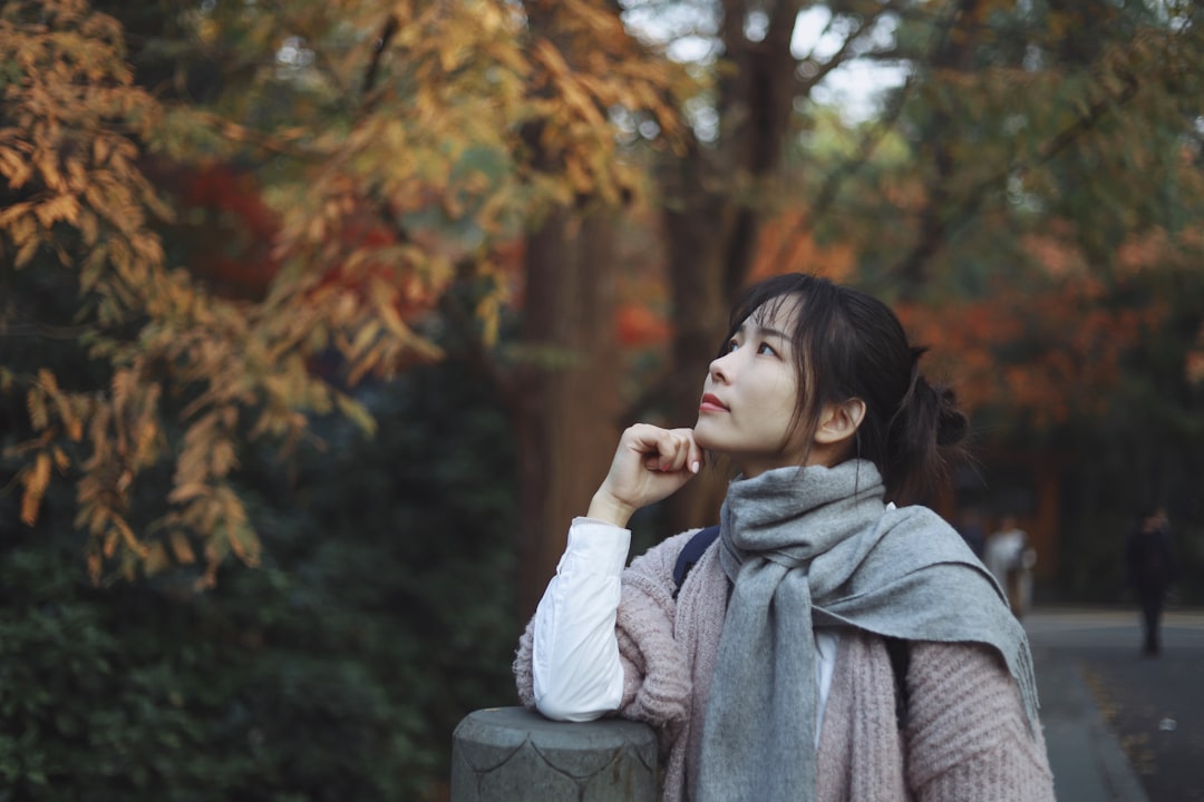 woman wearing sweater and scarf