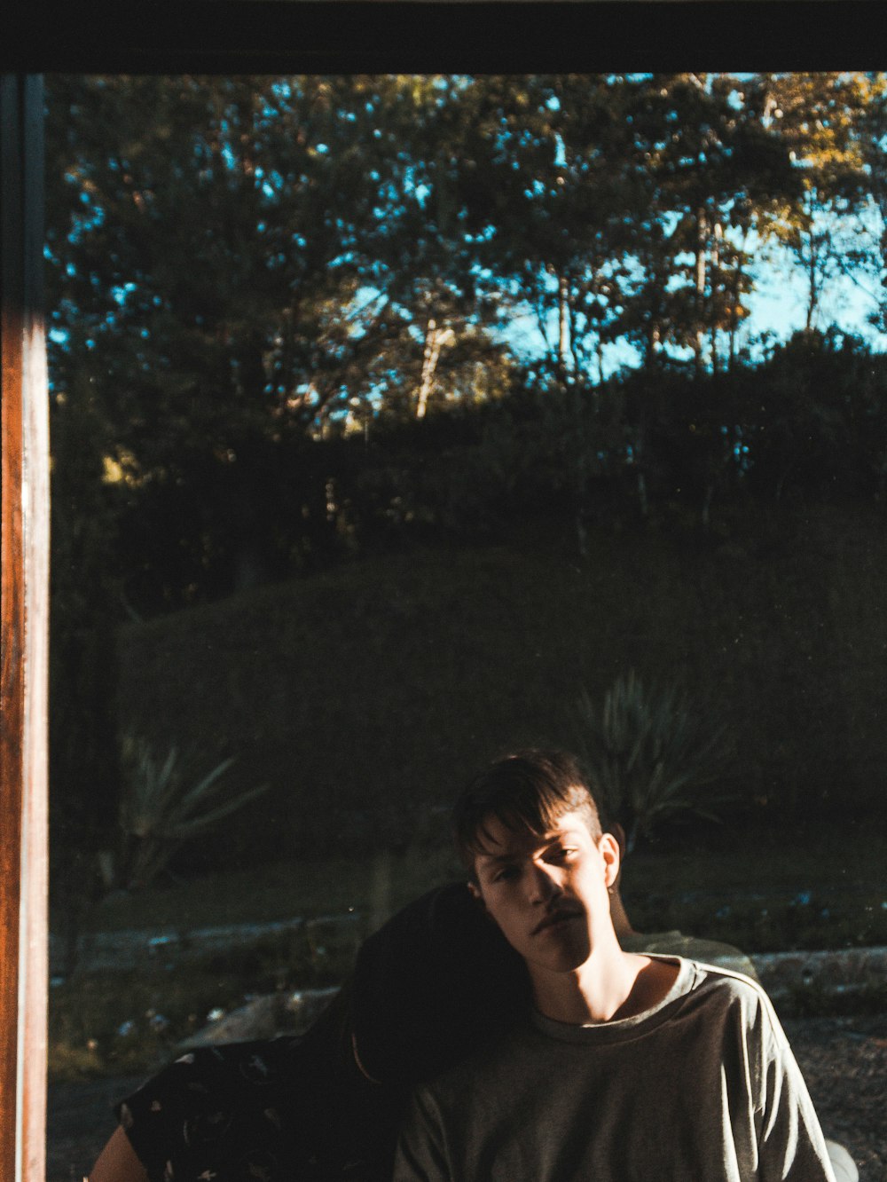 woman leaning on man's shoulder