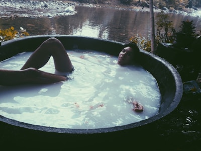 Person undergoing neuroregulation therapy in a specialized tub at StressBreakLab.