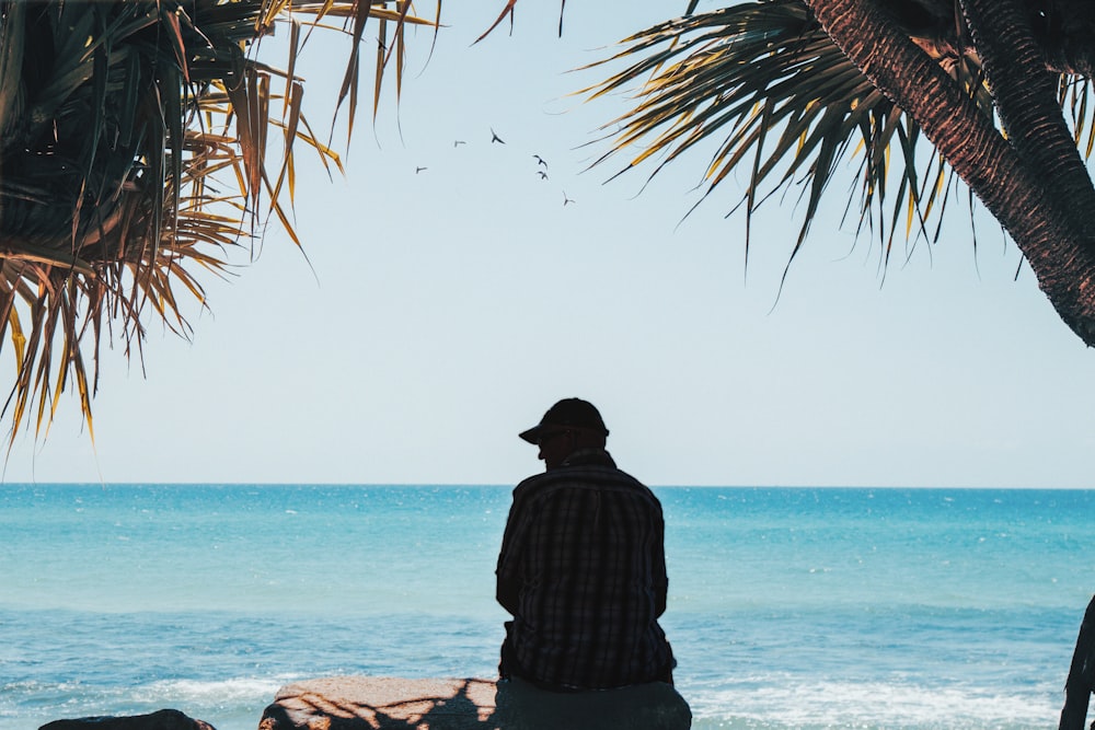 silhouette of person near body of water