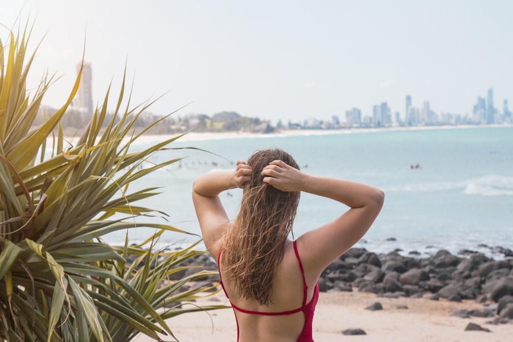 woman holding her head outdoor