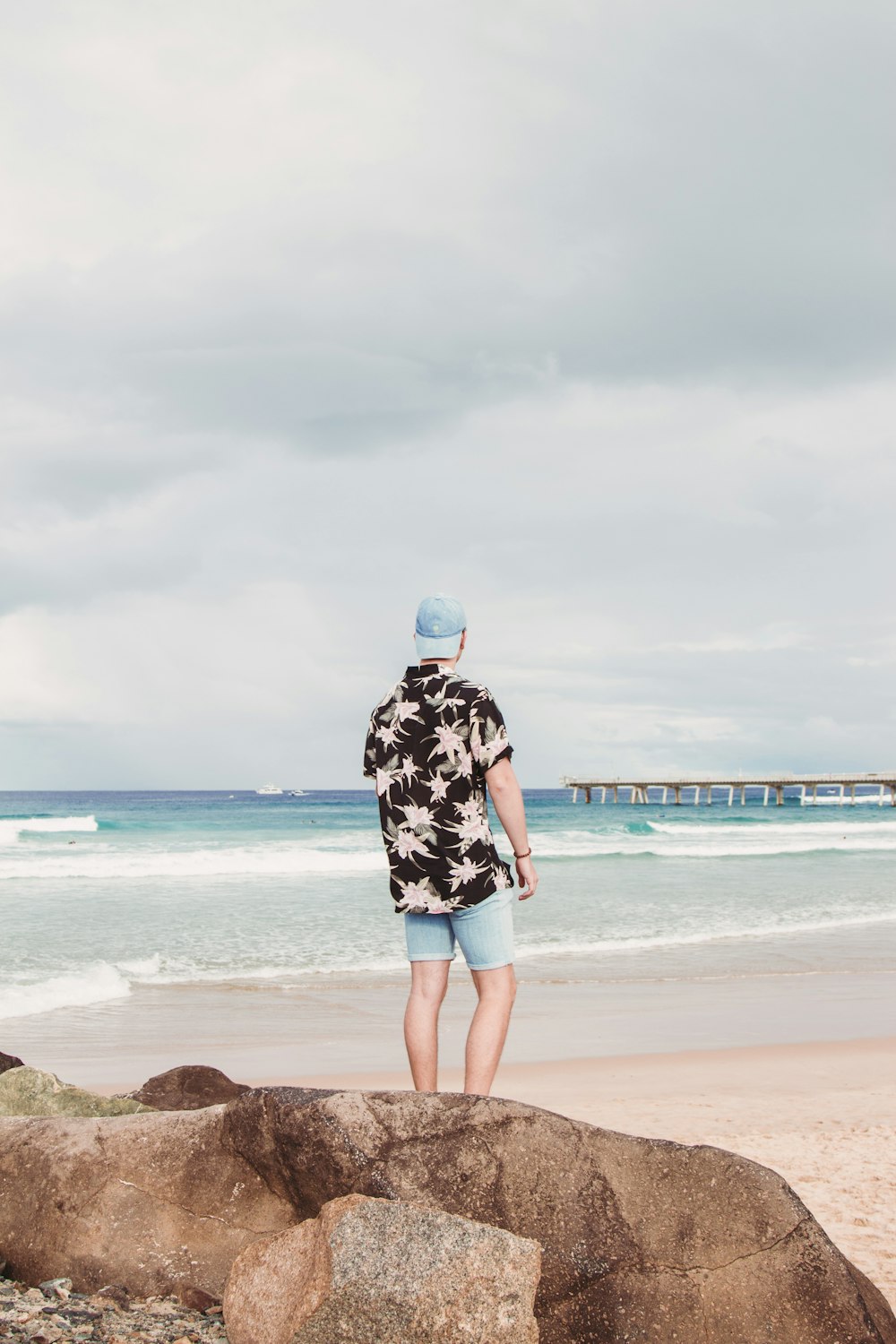 man standing near sea during daytime
