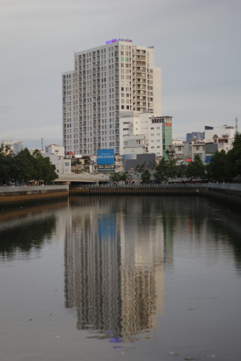 person showing white high-rise building