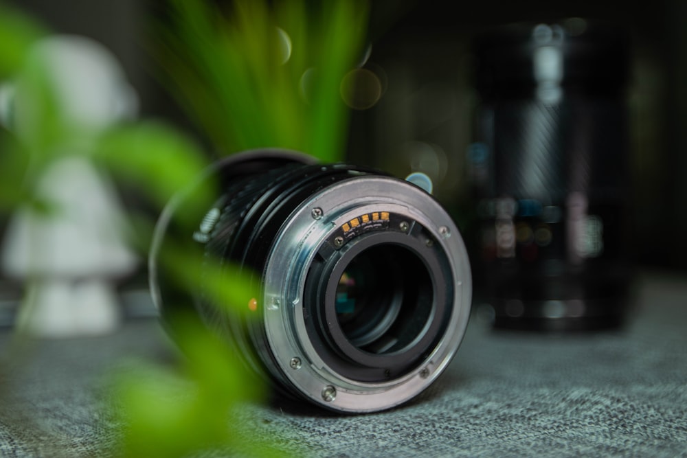 selective focus photography of black camera lens
