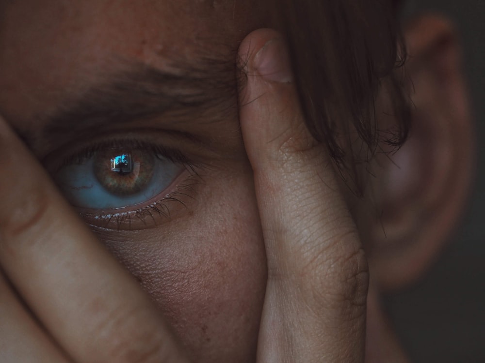 closeup photo of person's eye iris and eye pupil