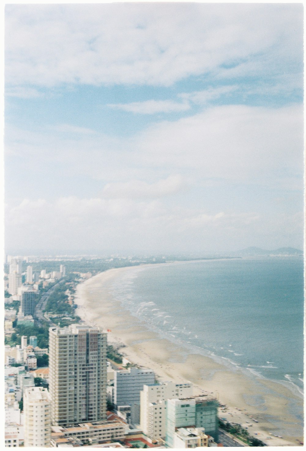 aerial photo of buildings near ocean during daytime