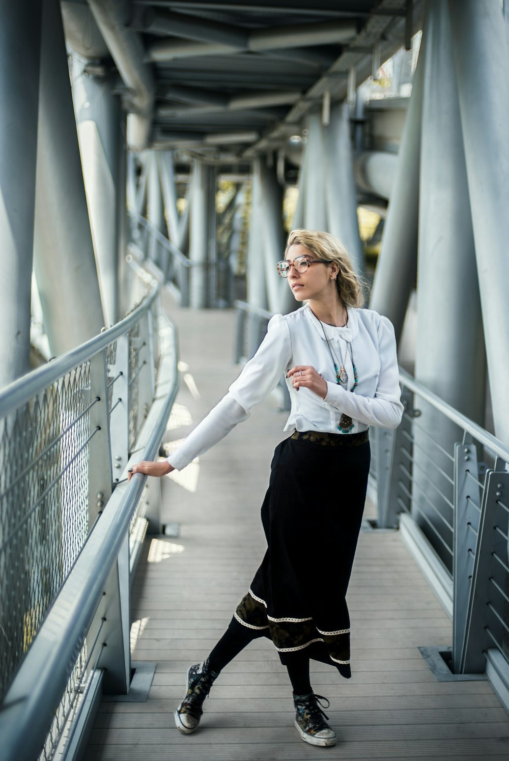 woman wearing dress holding railings