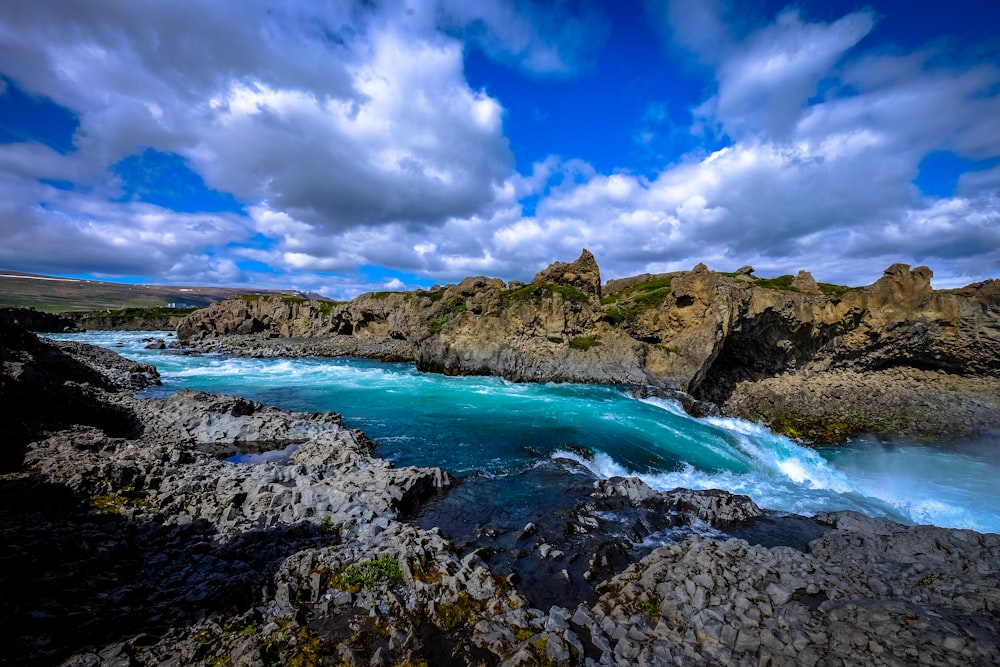 river surrounded by rocks