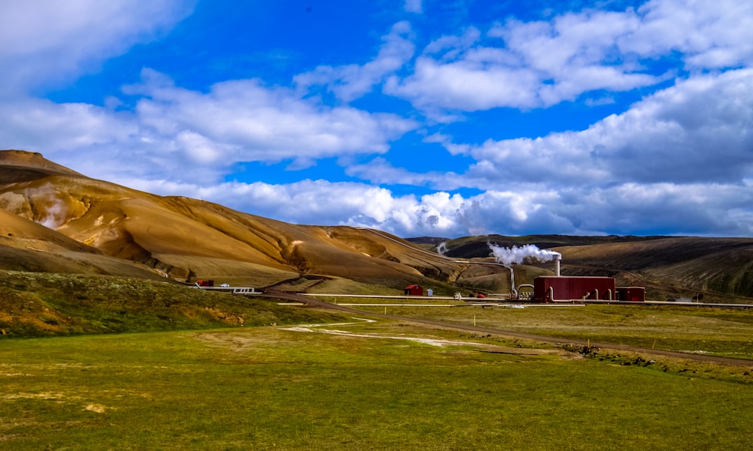 landscape photo of brown mountains under cloudy sky