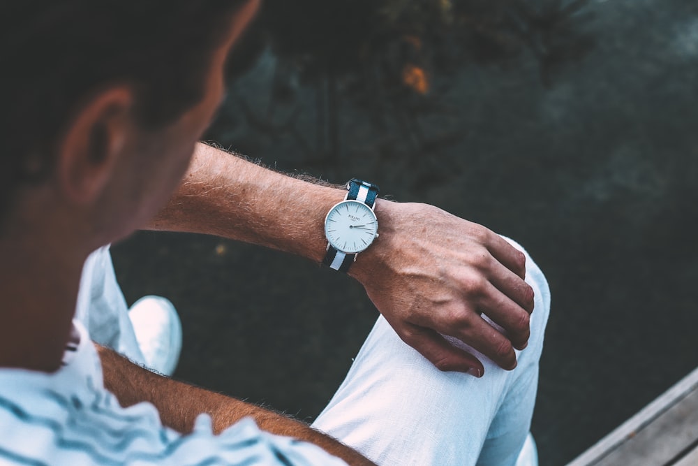 man staring on his watch