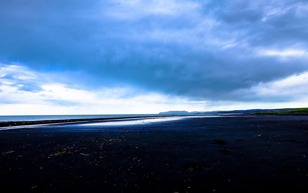 landscape photo of mountain under cloudy sky