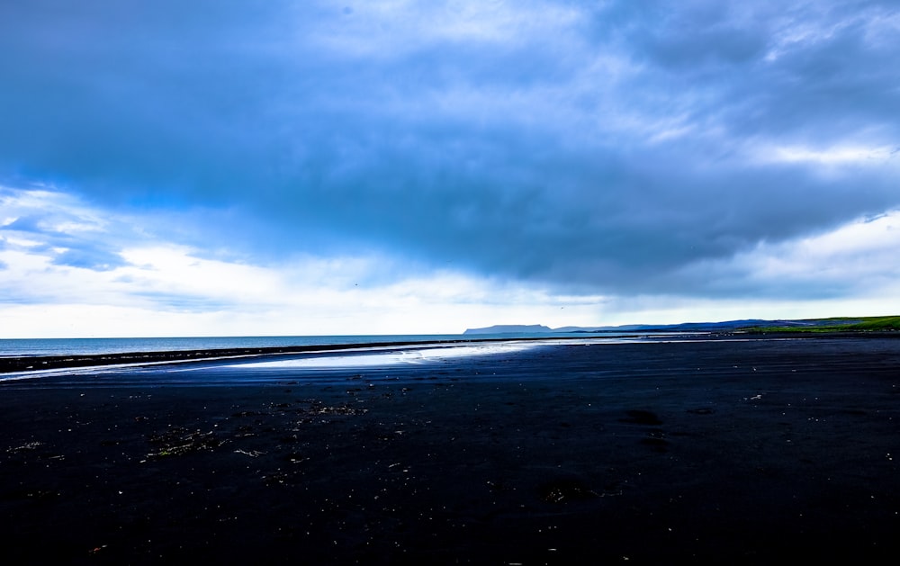 landscape photo of mountain under cloudy sky