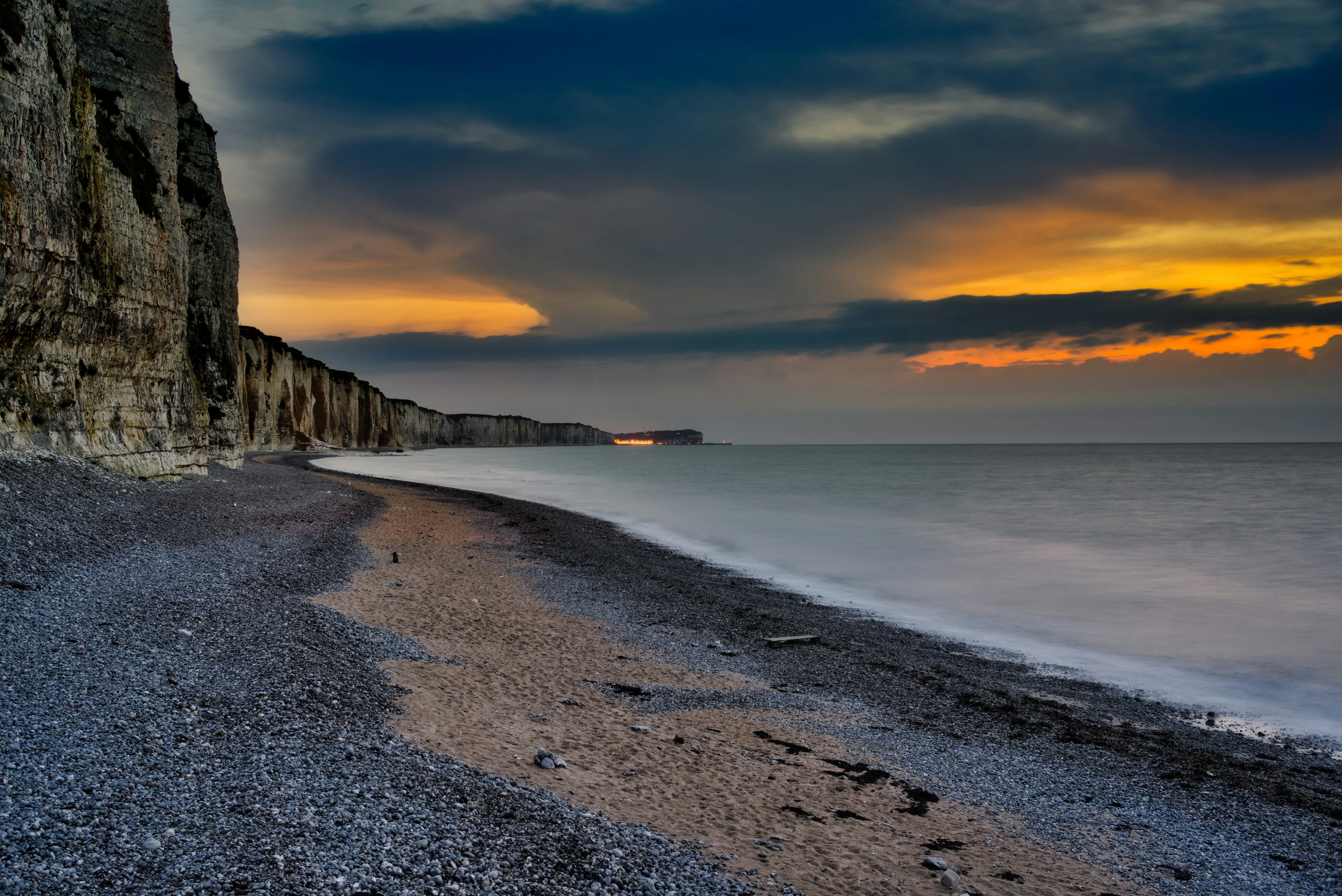 body of water near rock formation, Cliff