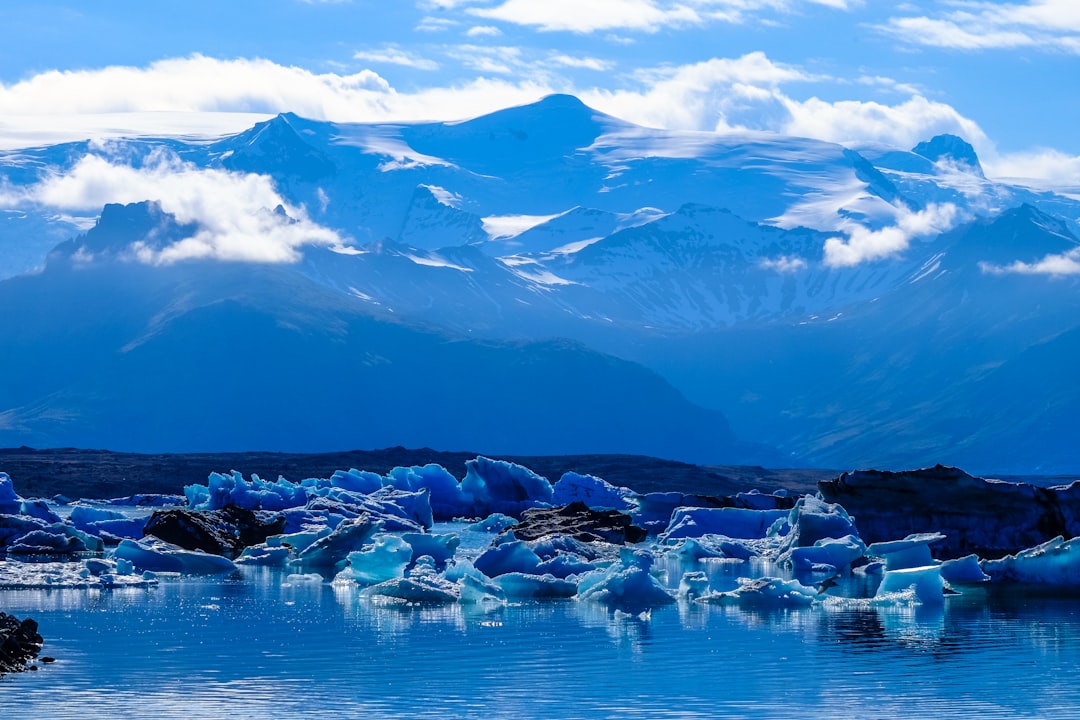 icebergs on body of water during daytime