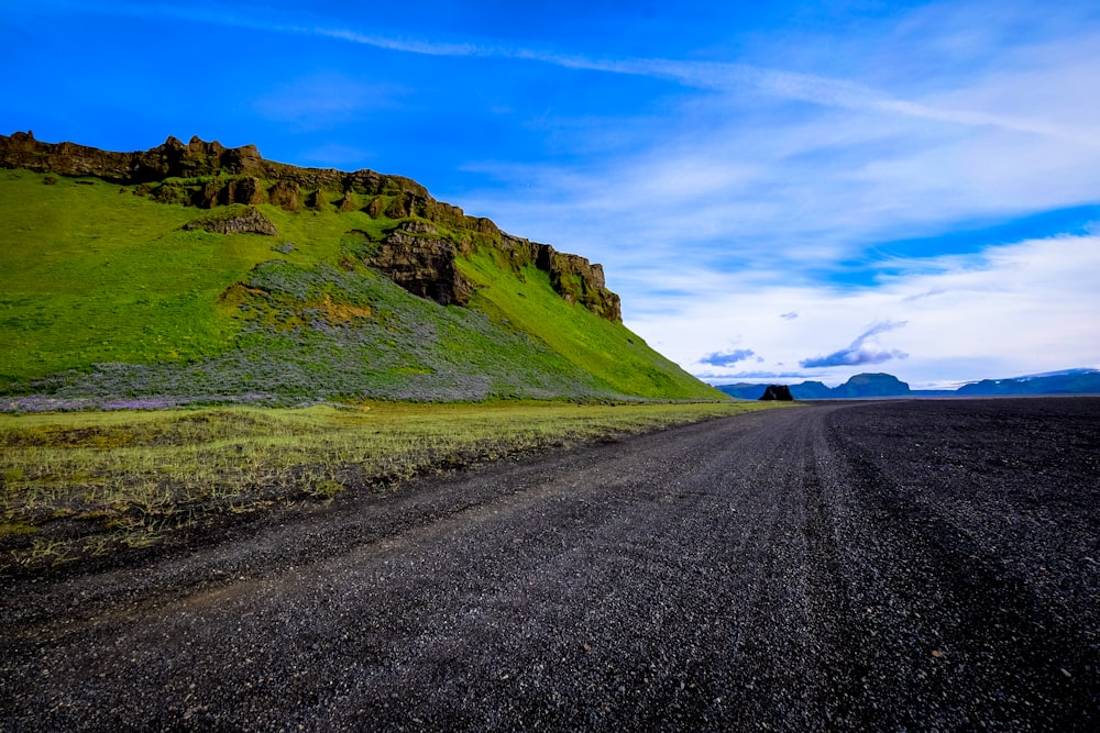 empty roadway near mountain