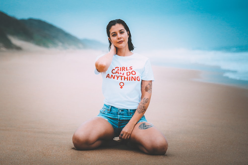 woman wearing white crew-neck shirt near sea