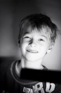 A warm, inviting photo of a child smiling gently, symbolizing hope and care.