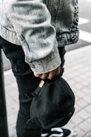 A snap of a cap styled with casual streetwear on a bustling Manila street.