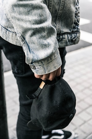 A snap of a cap styled with casual streetwear on a bustling Manila street.