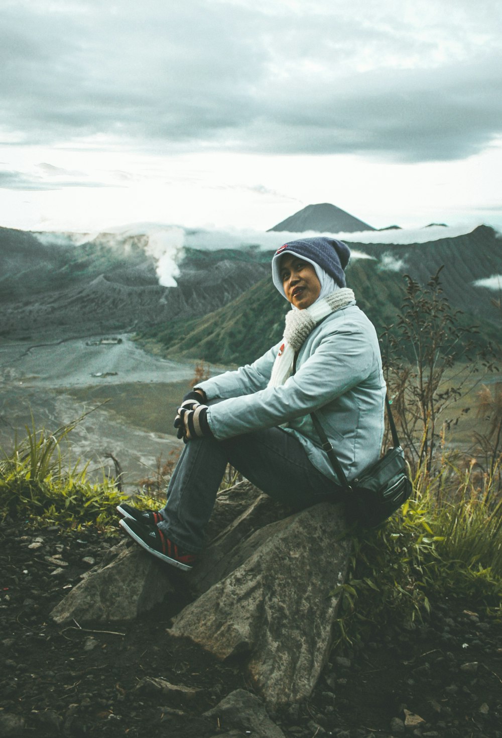 man sitting on rock formation