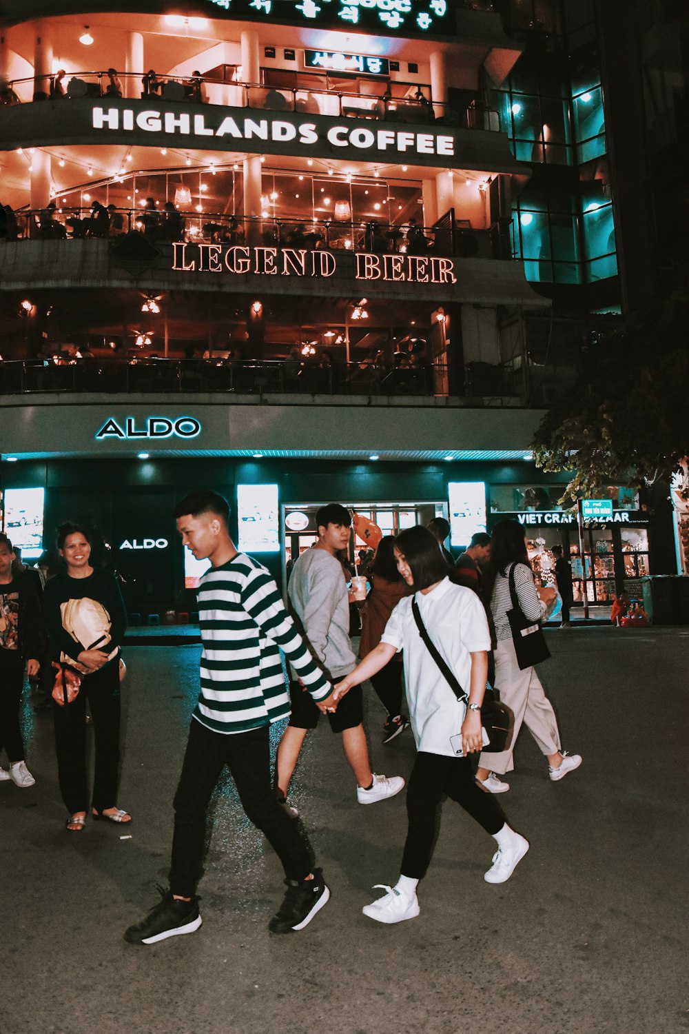 people walking on street during nighttime