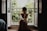 woman sitting on floor near window at daytime