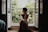 woman sitting on floor near window at daytime